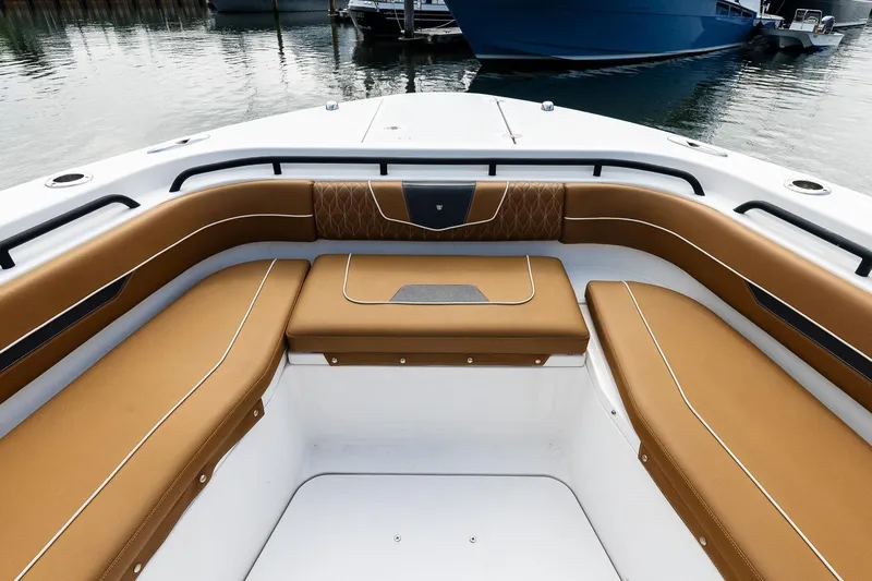 Yacht Photos Pics Luxurious seating on 2021 Wellcraft 402 Fisherman boat, featuring tan upholstery and sleek design.