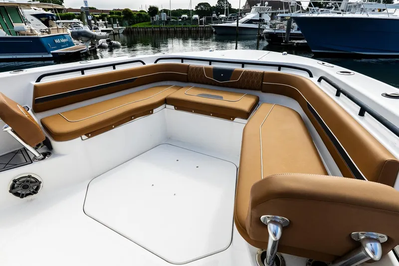  Yacht Photos Pics 2021 Wellcraft 402 Fisherman boat with luxurious tan seating in a marina setting.