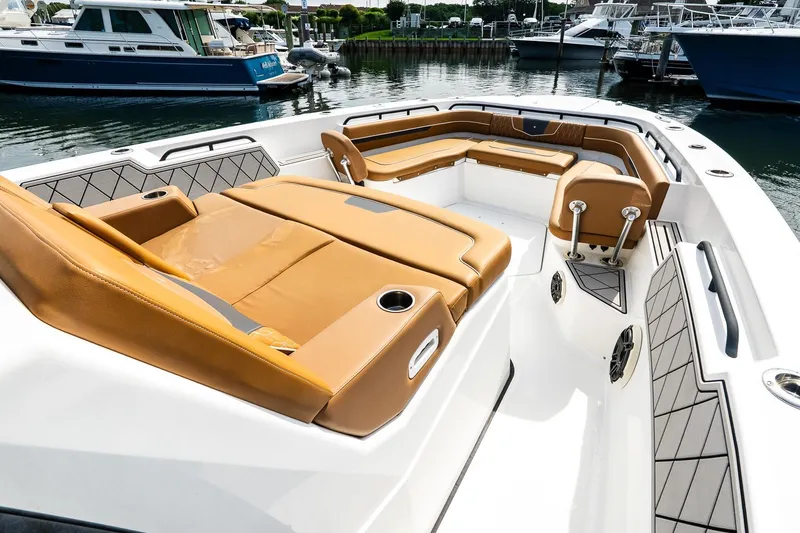  Yacht Photos Pics 2021 Wellcraft 402 Fisherman boat with luxurious tan seating in a marina setting.