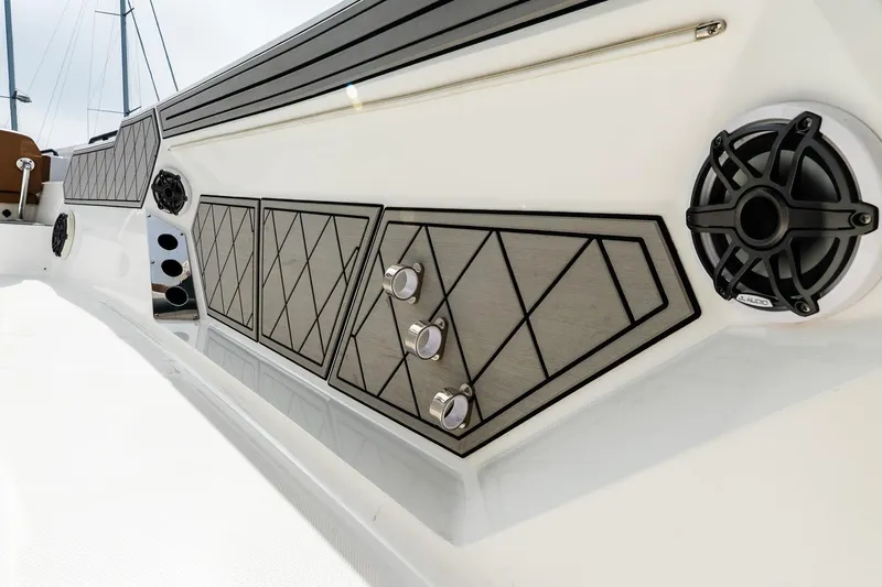  Yacht Photos Pics 2021 Wellcraft 402 Fisherman boat interior with speakers and stylish paneling.