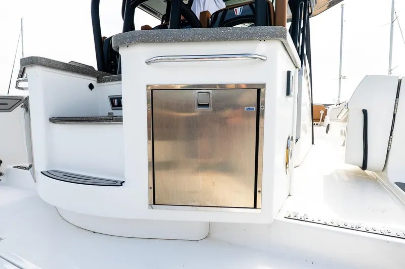  Yacht Photos Pics 2021 Wellcraft 402 Fisherman boat interior with stainless steel storage compartment.