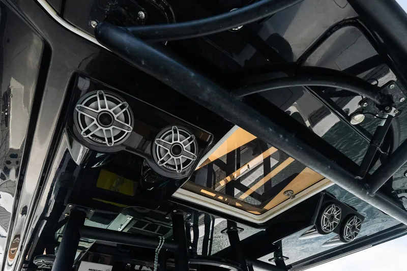  Yacht Photos Pics 2021 Wellcraft 402 Fisherman boat interior with speakers and sleek design.