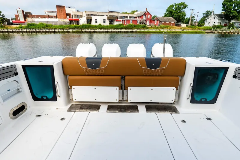  Yacht Photos Pics 2021 Wellcraft 402 Fisherman boat interior with seating and water view.