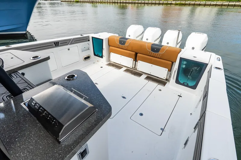  Yacht Photos Pics 2021 Wellcraft 402 Fisherman boat deck with seating and multiple outboard engines.