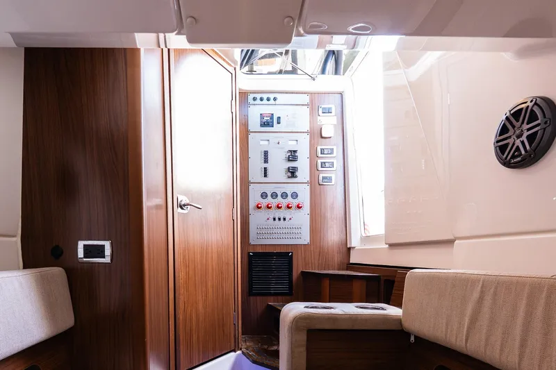  Yacht Photos Pics Interior of 2021 Wellcraft 402 Fisherman boat with control panel and seating.