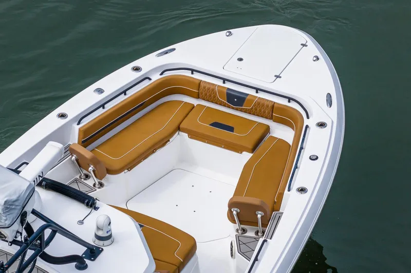  Yacht Photos Pics 2021 Wellcraft 402 Fisherman boat with tan seating, docked on calm water.