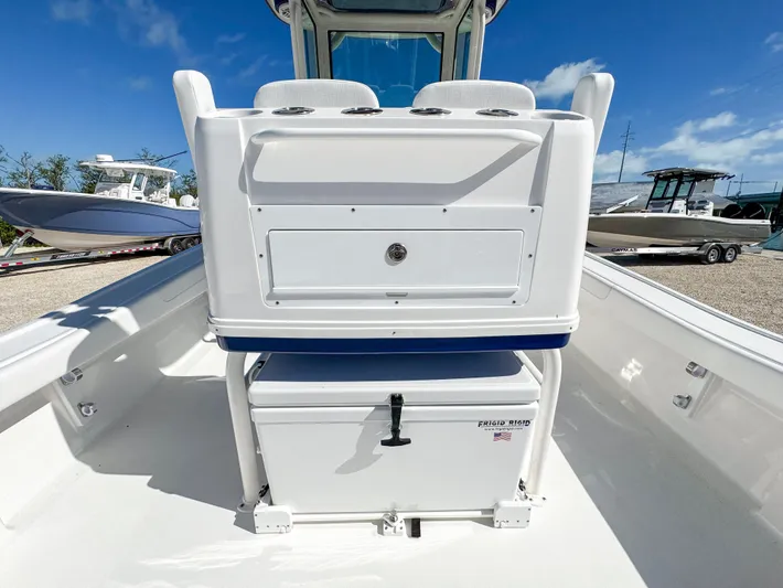  Yacht Photos Pics 2024 Caymas 28 HB boat interior with storage compartments and cooler.