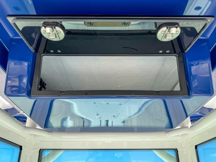  Yacht Photos Pics 2024 Caymas 28 HB boat console storage compartment.