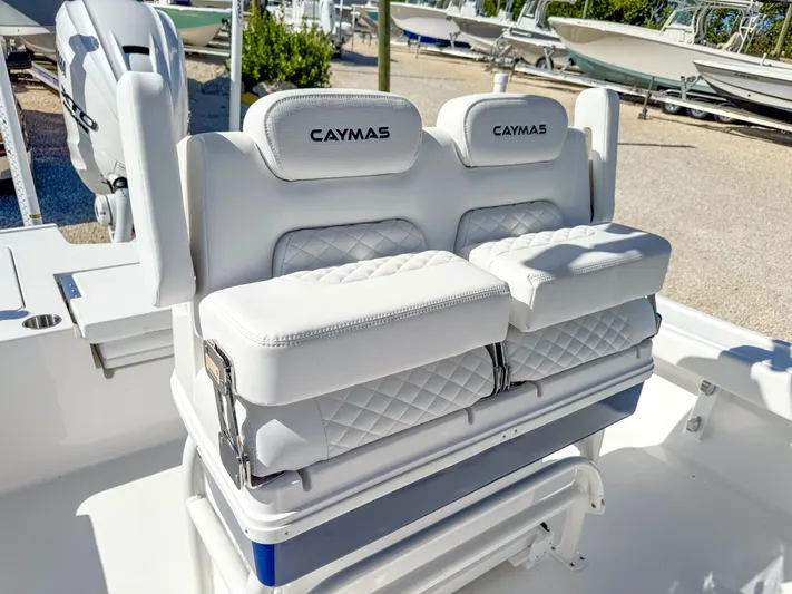  Yacht Photos Pics 2024 Caymas 28 HB boat with white cushioned seating and dual outboard motors.