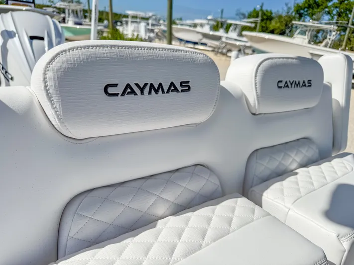  Yacht Photos Pics 2024 Caymas 28 HB boat with white quilted seats and headrests.