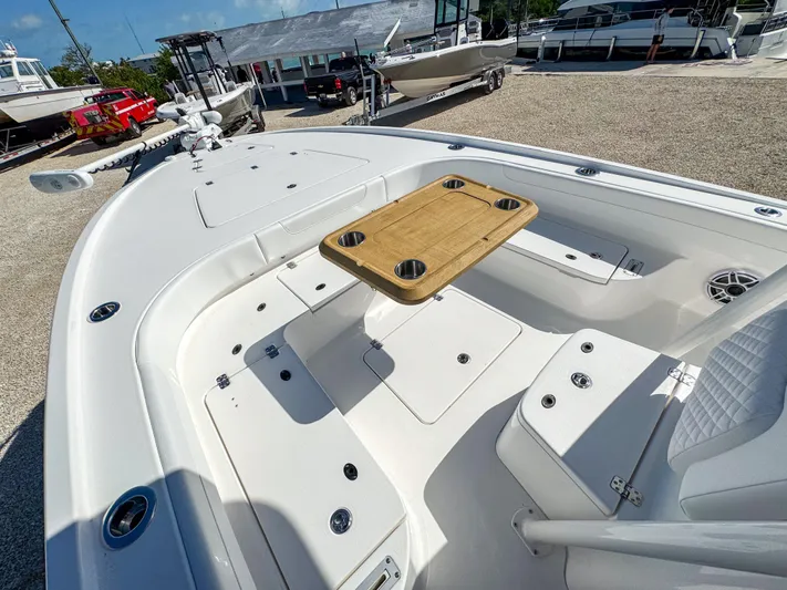  Yacht Photos Pics 2024 Caymas 28 HB boat with spacious seating and wooden table.