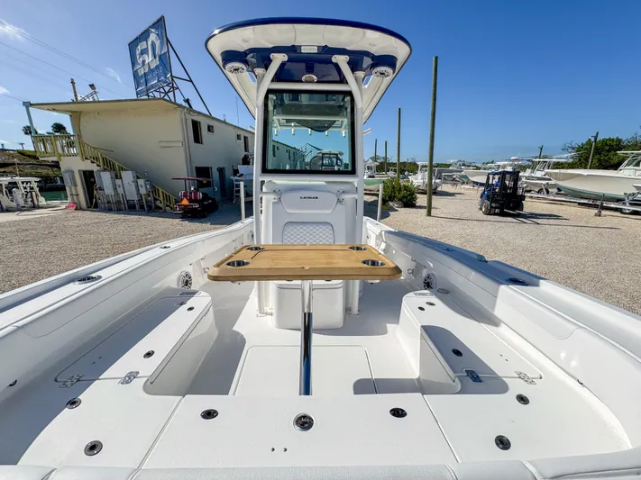  Yacht Photos Pics 2024 Caymas 28 HB boat with center console and wooden table.