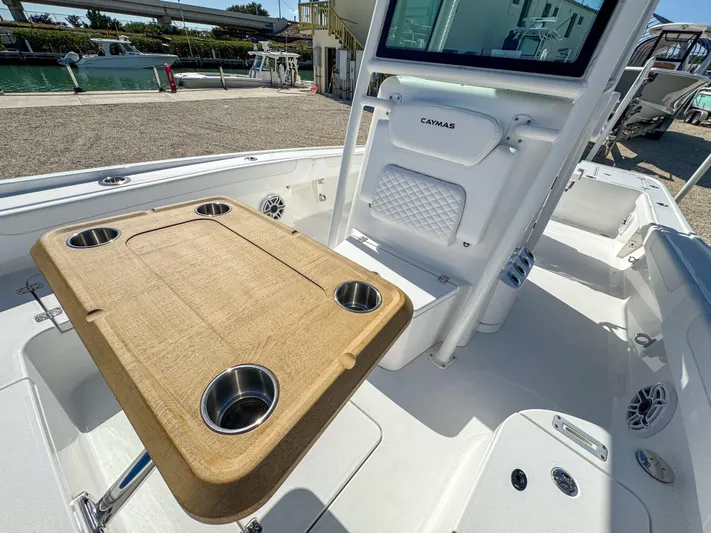 Yacht Photos Pics 2024 Caymas 28 HB boat interior with table and cup holders.