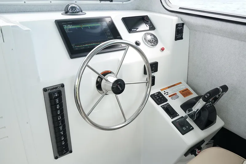  Yacht Photos Pics Manufacturer Provided Image: 2019 Parker 2520 XL Sport Cabin helm with steering wheel and control panel.