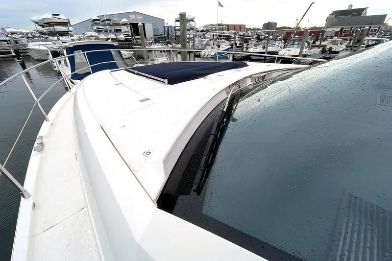  Yacht Photos Pics 2015 Fairline Targa 62 GT yacht at marina, showcasing sleek design and wet deck.