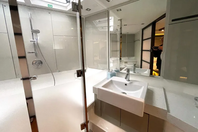  Yacht Photos Pics Luxurious bathroom in 2015 Fairline Targa 62 GT yacht with modern fixtures and spacious shower.