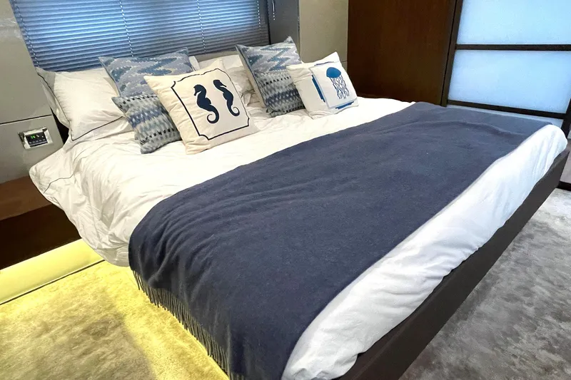  Yacht Photos Pics Luxurious bedroom interior of 2015 Fairline Targa 62 GT yacht with stylish bedding.