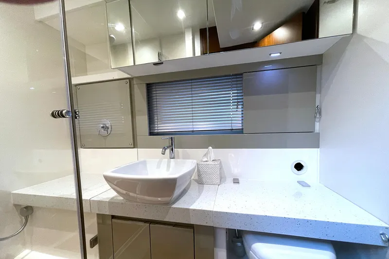  Yacht Photos Pics Luxury bathroom in 2015 Fairline Targa 62 GT yacht with modern fixtures.