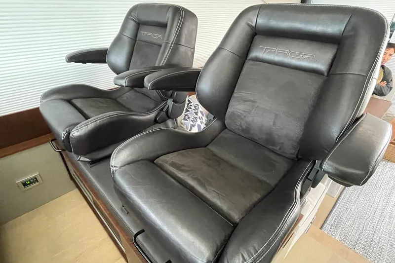  Yacht Photos Pics Luxurious black leather seats in a 2015 Fairline Targa 62 GT yacht interior.