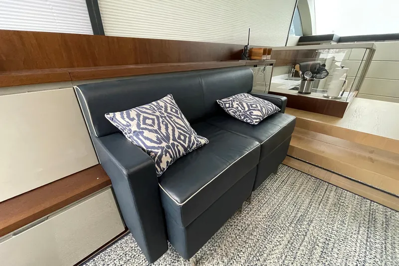  Yacht Photos Pics Luxurious interior of 2015 Fairline Targa 62 GT with stylish leather seating and patterned cushions.