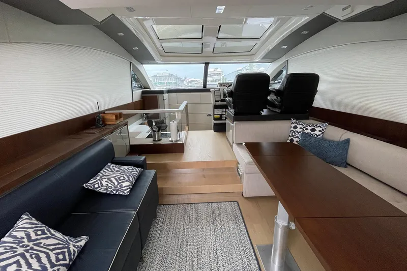  Yacht Photos Pics Luxurious interior of 2015 Fairline Targa 62 GT yacht with modern seating and decor.