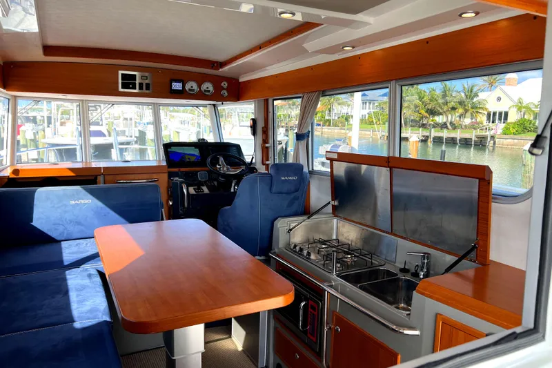 Maramor Yacht Photos Pics Interior of 2019 Sargo 33 All Season boat with seating and kitchen area.