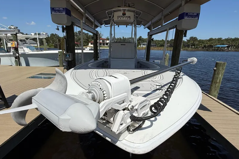  Yacht Photos Pics 2024 Contender 26 Bay boat docked, featuring advanced trolling motor and sleek design.