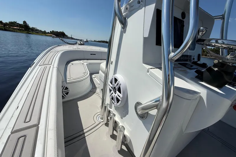  Yacht Photos Pics 2024 Contender 26 Bay boat interior with sleek design and modern features on a calm waterway.