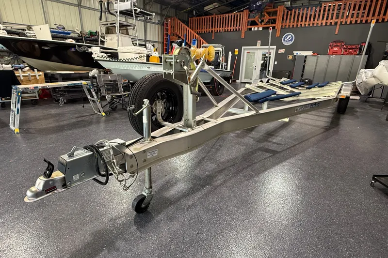  Yacht Photos Pics Boat trailer in a garage, designed for 2024 Contender 26 Bay model.