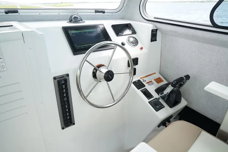  Yacht Photos Pics Manufacturer Provided Image: 2017 Parker 2820 XLD Sport Cabin helm with steering wheel and control panel.