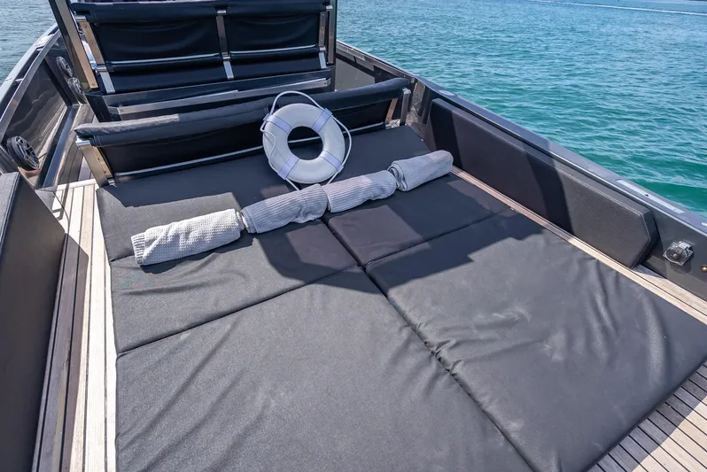  Yacht Photos Pics Luxurious 2012 Wally 43 yacht deck with sunbathing area and life preserver.