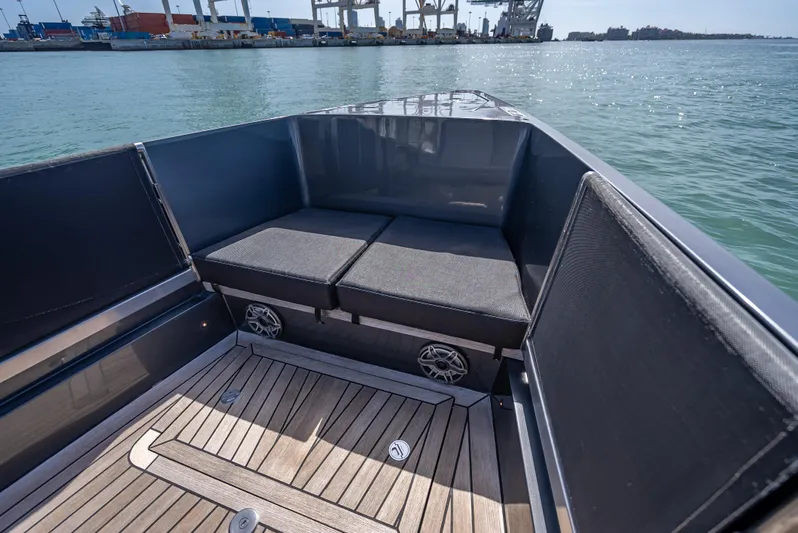  Yacht Photos Pics Luxurious 2012 Wally 43 yacht interior with cushioned seating and wooden deck.