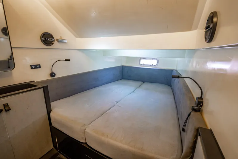  Yacht Photos Pics Cozy cabin interior of 2012 Wally 43 yacht with bed and modern lighting.