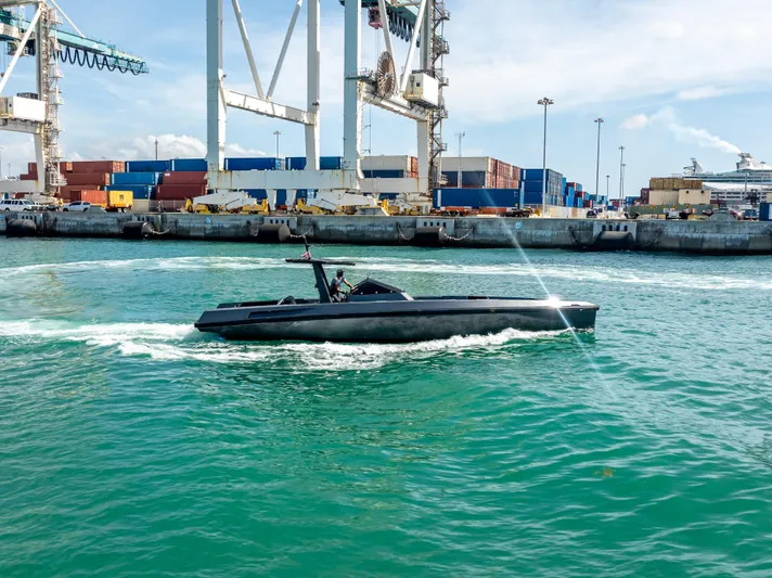  Yacht Photos Pics Sleek Wally 43 boat cruising near industrial port, 2012 model.