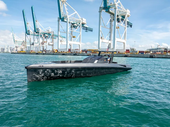  Yacht Photos Pics Wally 43 yacht from 2012 in a port with cranes in the background.