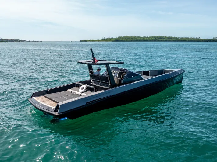  Yacht Photos Pics Sleek 2012 Wally 43 boat cruising on clear blue water.