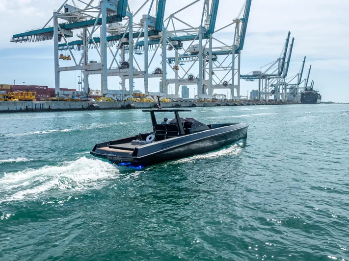  Yacht Photos Pics Wally 43 yacht cruising near industrial port cranes, 2012 model.