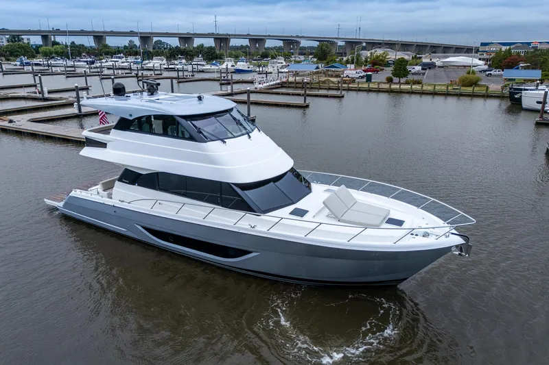 Norfolk Girl Yacht Photos Pics 2023 Maritimo M55 yacht docked in marina, showcasing sleek design and modern features.