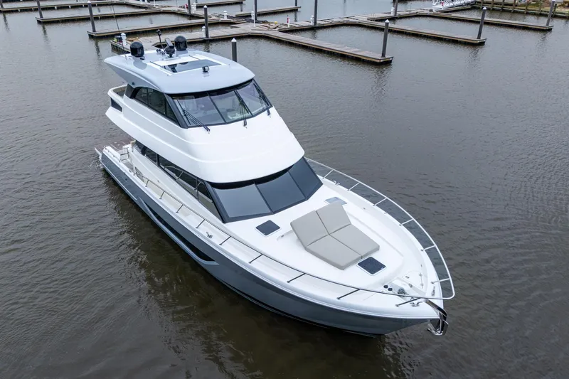 Norfolk Girl Yacht Photos Pics 2023 Maritimo M55 luxury yacht docked in a marina, aerial view.