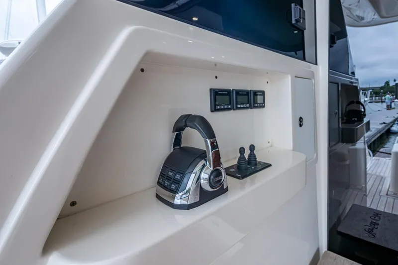 Norfolk Girl Yacht Photos Pics 2023 Maritimo M55 yacht control panel with throttle and joystick controls.
