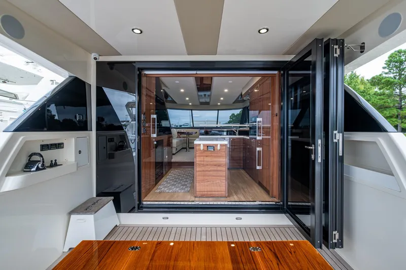 Norfolk Girl Yacht Photos Pics 2023 Maritimo M55 yacht interior with modern kitchen and sleek design.