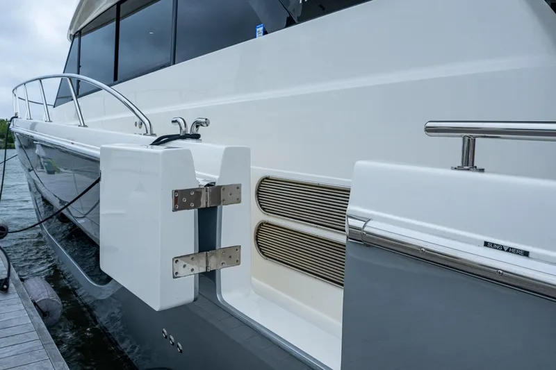 Norfolk Girl Yacht Photos Pics 2023 Maritimo M55 yacht docked, showcasing sleek design and modern features.