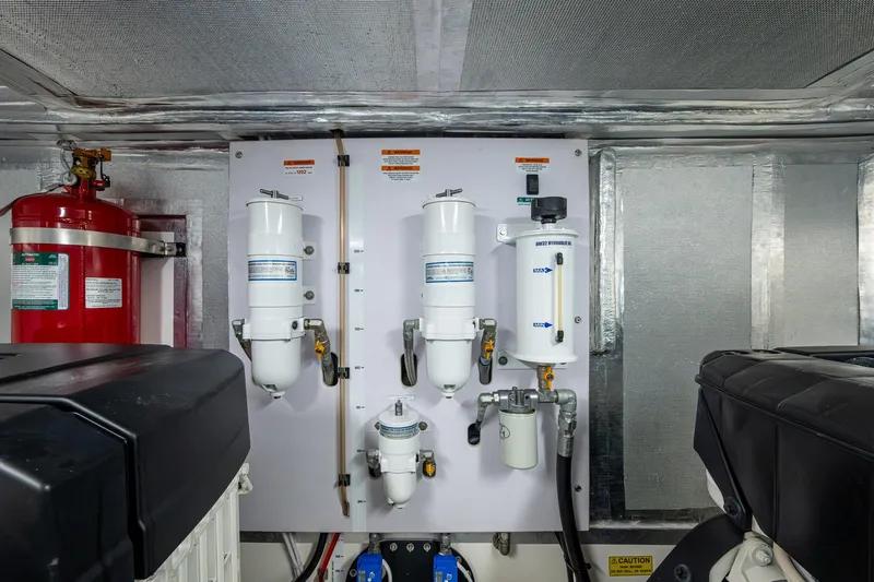 Norfolk Girl Yacht Photos Pics Engine room of 2023 Maritimo M55 yacht with fuel filters and fire extinguisher.