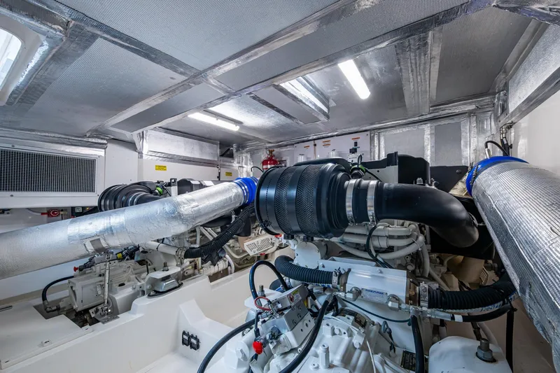 Norfolk Girl Yacht Photos Pics Engine room of 2023 Maritimo M55 yacht, showcasing advanced machinery and ventilation systems.