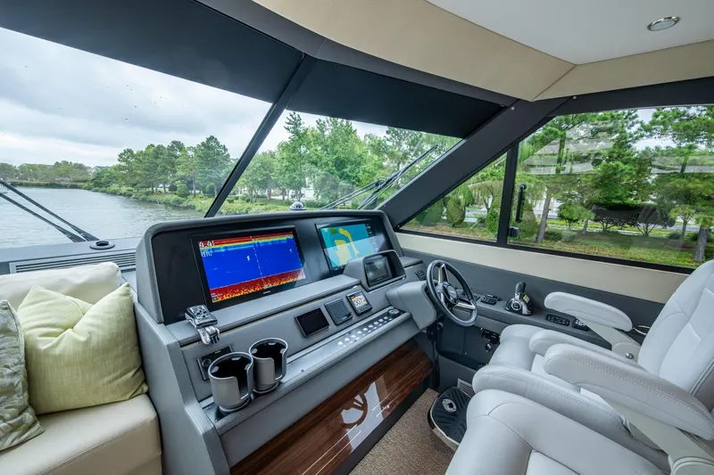 Norfolk Girl Yacht Photos Pics Luxurious 2023 Maritimo M55 yacht cockpit with advanced navigation displays and plush seating.