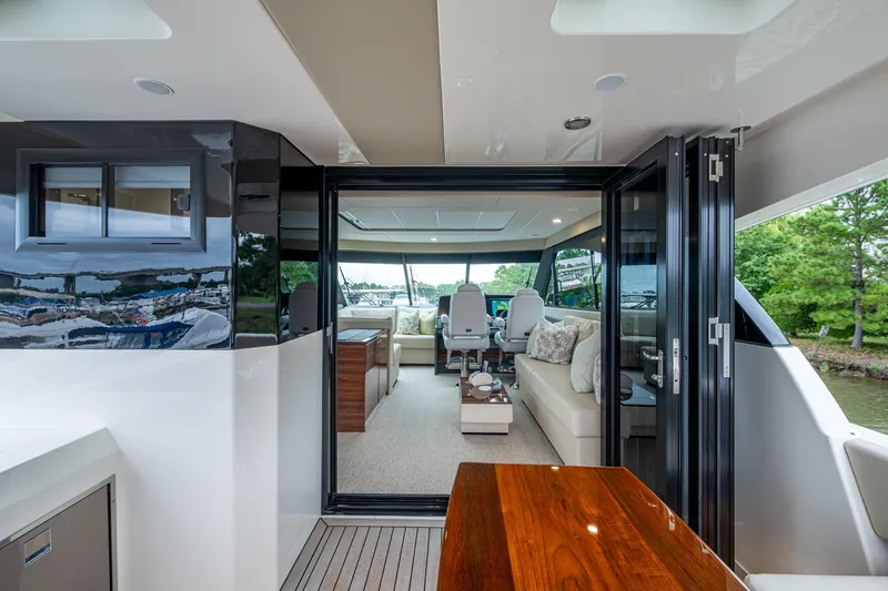 Norfolk Girl Yacht Photos Pics 2023 Maritimo M55 yacht interior with luxurious seating and modern design.