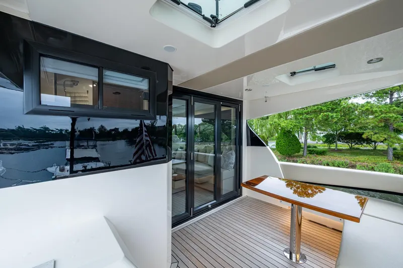 Norfolk Girl Yacht Photos Pics 2023 Maritimo M55 yacht deck with sleek design and modern furnishings.