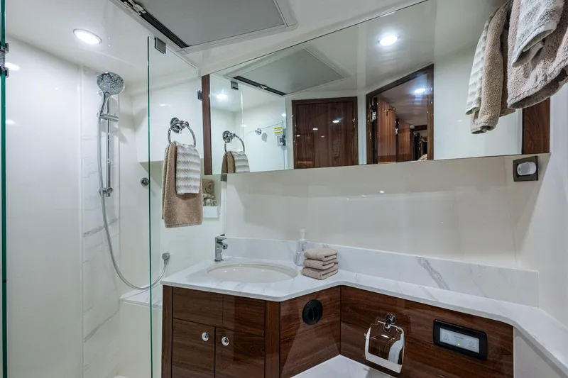 Norfolk Girl Yacht Photos Pics Luxurious bathroom in 2023 Maritimo M55 yacht with modern fixtures and elegant design.