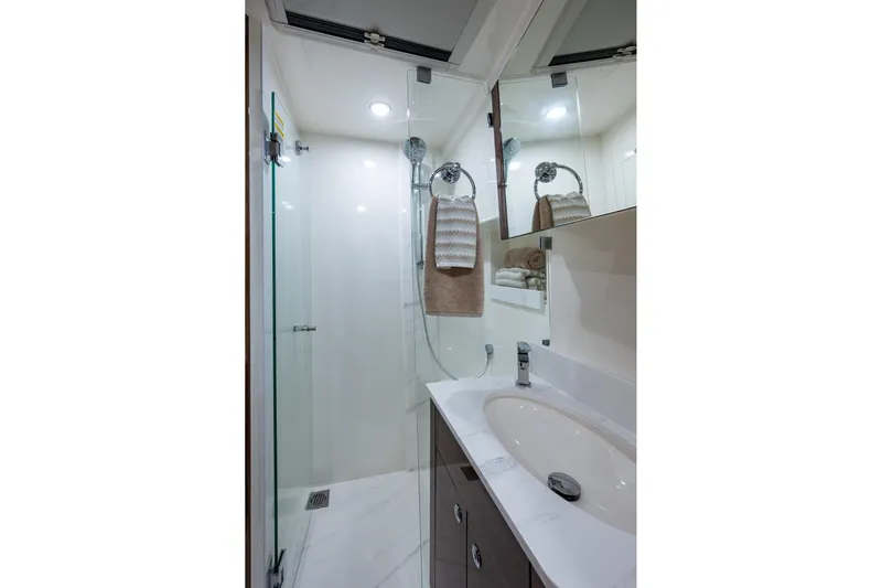 Norfolk Girl Yacht Photos Pics Luxurious bathroom in 2023 Maritimo M55 yacht with modern fixtures and elegant design.