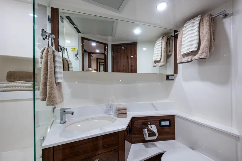 Norfolk Girl Yacht Photos Pics Luxurious bathroom in 2023 Maritimo M55 yacht with modern fixtures and elegant design.